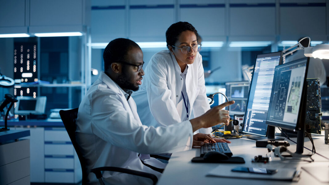 Researchers With Computer